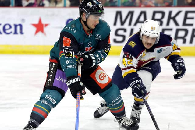 Belfast Giants’ Gabe Bast with Guildford Flames' Jordan Klimek during Saturday night’s Elite Ice Hockey League game at the SSE Arena, Belfast.     Photo by William Cherry/Presseye