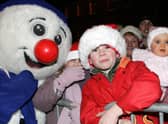 Barry, Annie and Louise pictured with a snowman in Garvagh during the Christmas lights switch on