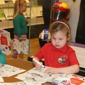 Children from Ballymoney & District Nursery enjoying colouring in at Ballymoney Museum.