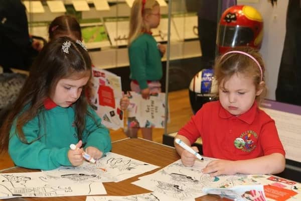 Children from Ballymoney & District Nursery enjoying colouring in at Ballymoney Museum.