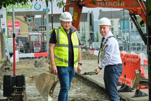 Mid Ulster Council Chairman, Councillor Eugene McConnell is pictured ‘breaking ground’ on the new £4m Maghera Public Realm Scheme alongside Paul McFlynn, contracts director at CivCo. Credit: Mid Ulster District Council