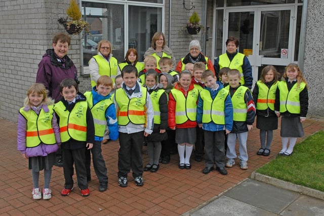 Dickson Primary School P3 pupils prepare to set off on their walk in March 2010 as part of the Practical Child Pedestrian Training Scheme with Vivienne Nicholl and Lorna Dougan, road safety officers from the DOE road safety education office in Armagh. Included are their teacher Mrs Wigham and class assistants who accompanied them.