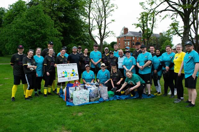 Lisburn Hawks and Eagles make a donation the Moira Hygiene Bank during their Derby match at Wallace Park