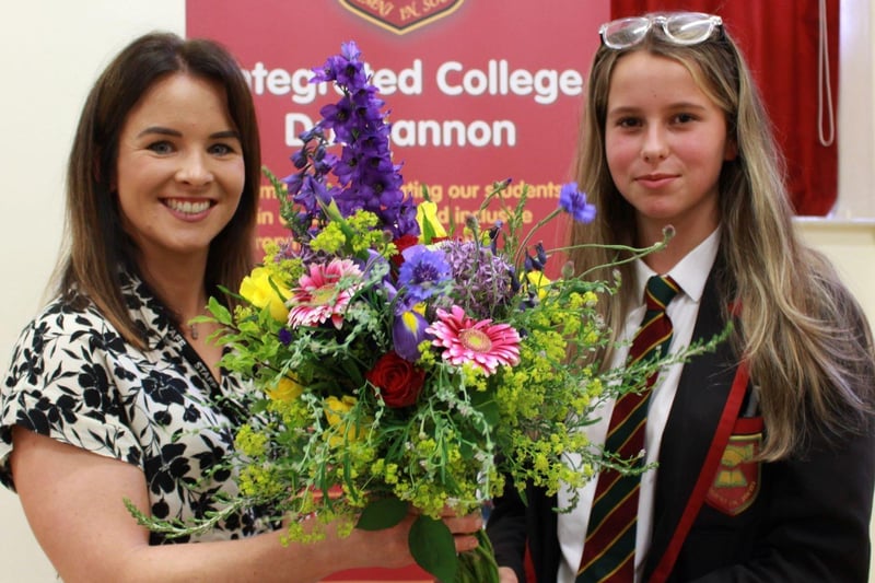 Head of Year 10, Miss Emma McShane, is presented with a bouquet of flowers at ICD’s Prize-Giving, by student, Peyton Young. Credit: Ita Darragh