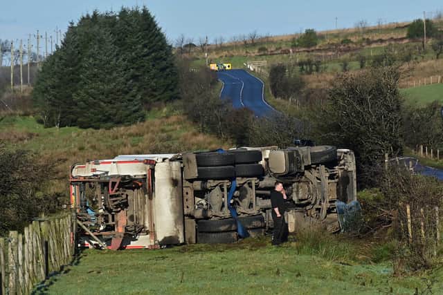 A bin lorry overturned during freezing conditions in the Hannahstown area on the outskirts of Belfast on Monday morning. Picture: Colm Lenaghan/ Pacemaker