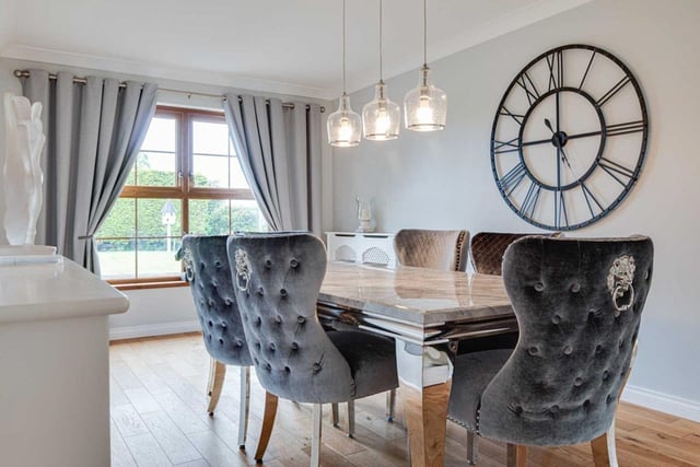 Dining room with solid wood strip floor.