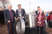A commemorative racing car sculpture was unveiled in Ballyrobert in 2014 as a lasting legacy to the English Racing Automobiles racing car that won the first international road race in Britain after the Second World War in 1946. Then Mayor, Ald Fraser Agnew, is pictured with Mr and Mrs David Beattie from the village and Ald Mark Cosgrove. (Pic: Freddie Parkinson).