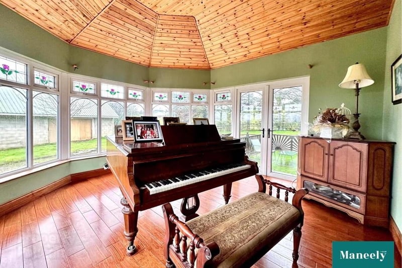 Sun room with vaulted tongue and groove ceiling.