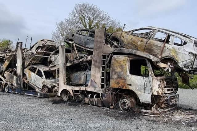Attack which saw 11 vehicles and a transporter destroyed on the Derrylee Road, Portadown, Co Armagh is being treated as arson, says PSNI.