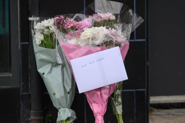 Floral tributes have been placed at the scene of the fatal collision in the High Street area of Carrickfergus.Photo: Pacemaker Press.