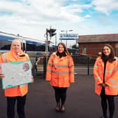 Translink’s John Glass Director of Infrastructure with Megan Lutton Project Manager and Kate Finnegan PR Manager at the Cullybackey project announcement in 2021.