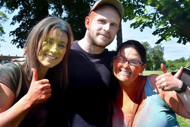 Some of the parents who attended the colour run also got involved. Pictured are from left, Michaela Maher, Ryan Telford and Sarah Reynolds. PT21-216.