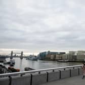 A woman crosses London Bridge during what would usually be the busy pre-9am rush-hour (Photo: Leon Neal/Getty Images)