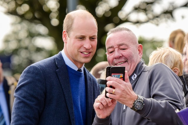 The Prince of Wales stops for a selfie with this delighted member of the crowd in Carrickfergus.