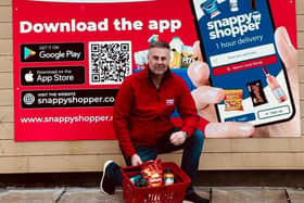 Malcolm Hall, who owns Vivo@FoodHalls Drumgor in Craigavon, with the special one-day basket of groceries. Picture: Snappy Shopper.
