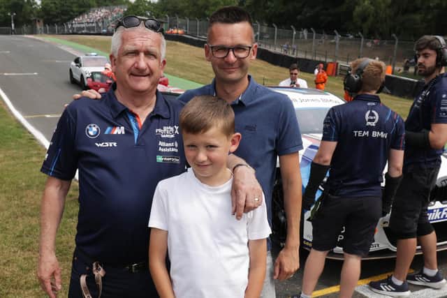 Portadown man Trevor Turkington with his son Gary and grandson Henry after Trevor's other son Colin won Race 3 of the British Touring Car Championships in Oulton Park. Photo courtesy of Jakob Ebrey Photography