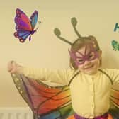 A colourful little butterfly enjoying World Book Day.