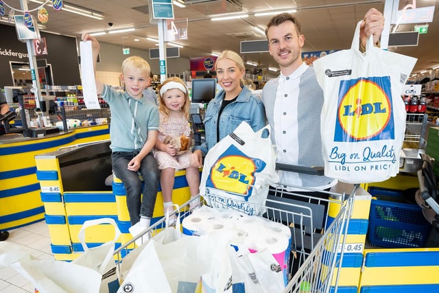 David Long with family, Florence, partner Ashleigh and Harry at the Carrickfergus store.