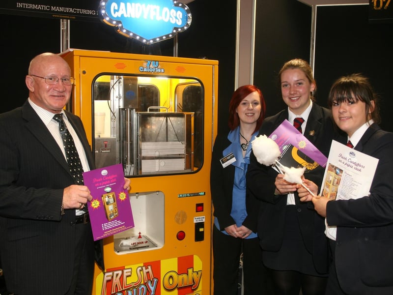 David Hawthorne and Emma O'Boyle, of Intermatic Manufacturing Ltd, talk about their Candyfloss machine with Ballymena Academy pupils Catherine Allen and Catherine McGivern, during the Invest NI Innovation Week 2007. BT21-204AC
