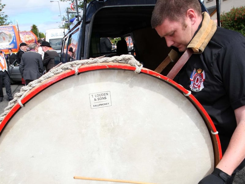 Ballynure Lambeg and Drumming Club make the last minute adjustments for the 12th day in Ballyclare. NT29-008FP