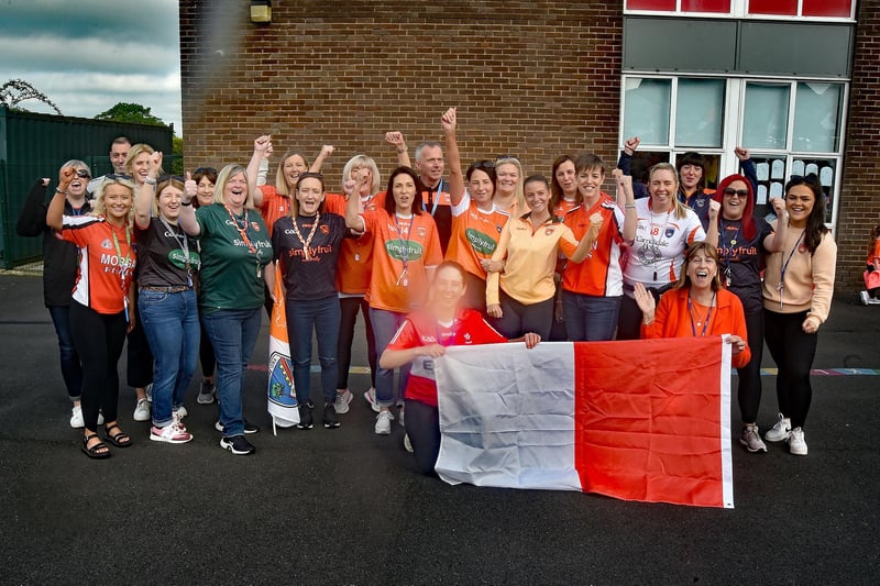 Staff of St John The Baptist Primary School - Bunscoils Eoin Baiste and Naiscoil Na Banna showing their support on Armagh Day. PT19-210.