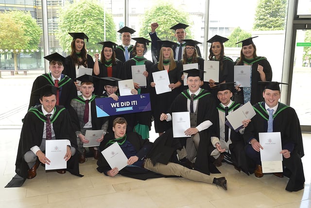 Students celebrating their graduation at Ulster University.