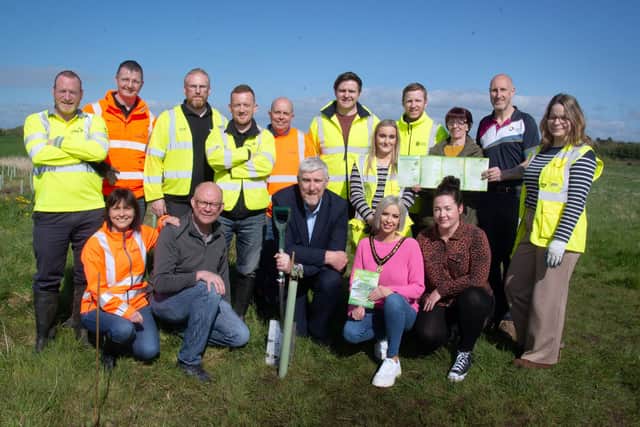 Infrastructure Minister, John O'Dowd, front centre, pictured with councillors, volunteers and community representatives at the planting of trees between Churchill Park and the River Bann on Wednesday. PT17-203. Picture: Tony Hendron
