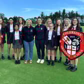 Louisa McLean and Amy Caulfield pictured with the U14A team from Coleraine Grammar School. CREDIT LOUISA MCLEAN