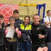 Gardai Kate Patterson who presented the medals with the boxers and coaches, pictured with Daniel McGuinness.