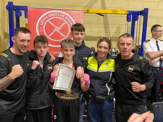 Gardai Kate Patterson who presented the medals with the boxers and coaches, pictured with Daniel McGuinness.