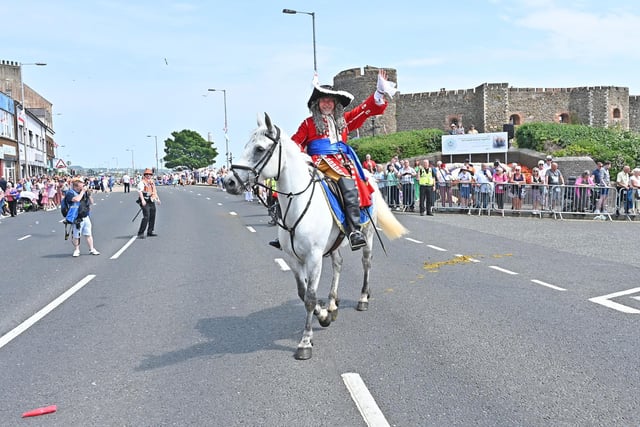 King William waves to the crowd in Carrickfergus.