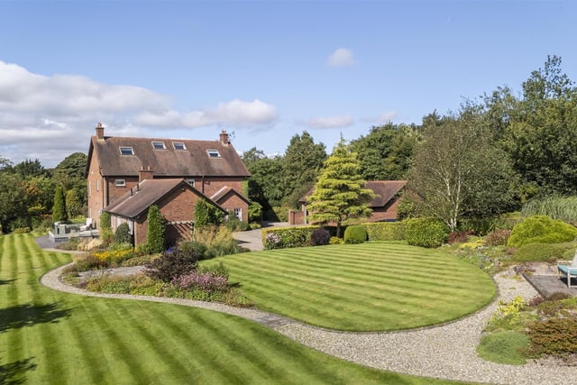 Fully landscaped site (c.2 acres), with immaculately presented gardens, finished in range of lawns, patio areas, and a wide array of mature plants, trees and shrubbery.
