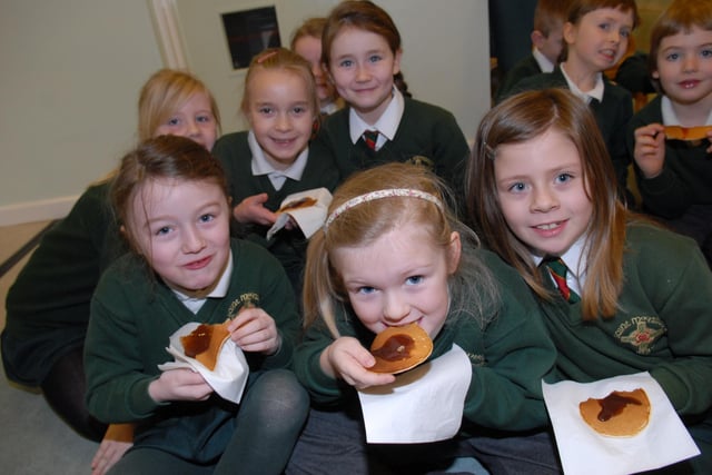 Tucking into pancakes during Pancake Day at St MacNissi's Primary School in 2013.