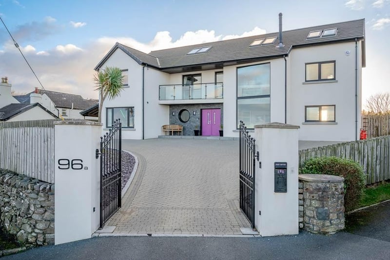 On the market for offers around £694,950 with John Minnis Estate Agents, this outstanding detached family home was constructed around 2008.  Situated on an idyllic coastal site with stunning views of Donaghadee Sound, the Copeland Islands, the Irish Sea and beyond, the property has five bedrooms along with a cinema room and a games room.  To the exterior are a driveway and forecourt finished in attractive brick paviour, and a fully enclosed rear garden and entertainment space with lawns, an extensive terrace, a covered seating area for entertaining, and a built-in barbecue/fire.