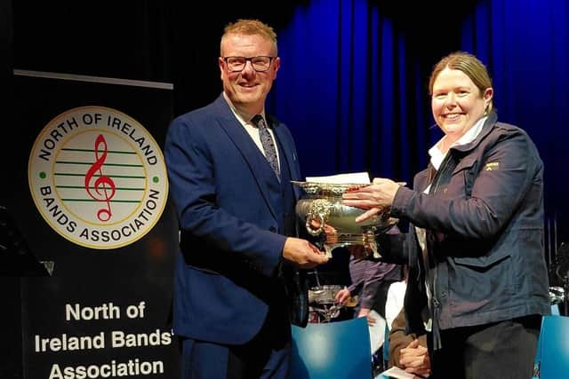 CWA Secretary Fiona Gray receiving the trophy for winning the second section at the contest from adjudicator Richard Marshall