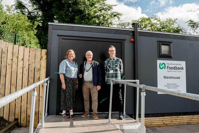 At the opening of the new Newtownabbey Foodbank warehouse are, from left: Julianne Broten-Nobel, area manager for Trussell; Mayor of Antrim and Newtownabbey, Councillor Henry Cushinan and Graeme Craig, manager of Newtownabbey Foodbank. Picture: Matthew Russell Creative