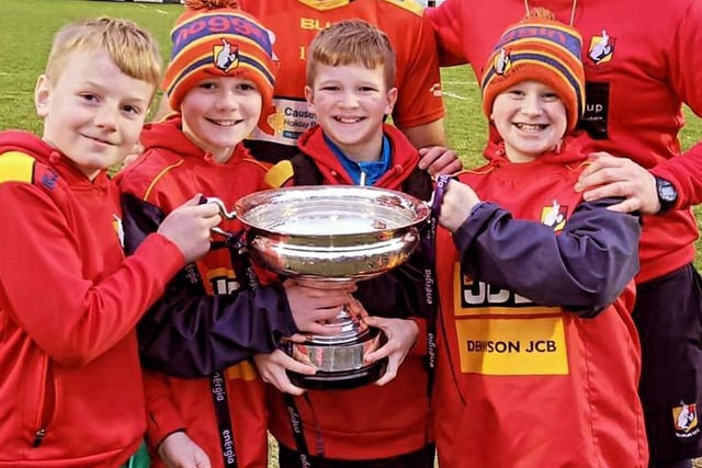 Young players and fans joined the team after the famous victory.