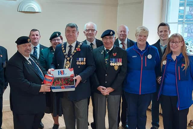 The Mayor, Alderman Noel Williams with Derick Robers, Carrick Poppy Appeal organiser, and colleagues at the launch in Carrickfergus.