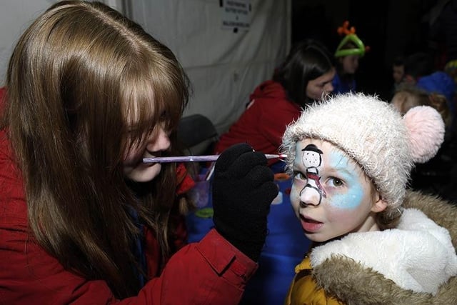 Putting the finishing touches to a festive face-painting design at the Tandragee switch-on.