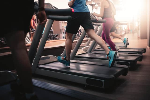 People running in machine treadmill at fitness gym club. Photo: Adobe
