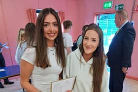 Students looking pleased with their grades.