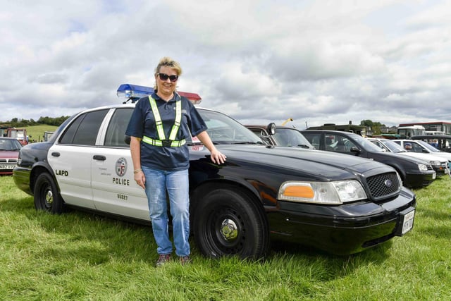 Gwen Bartley of the Policing and Community Safety Partnership takes a closer look at an American police car on display at the Vintage Rally.