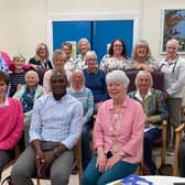 Members of Ballymoney Soroptimists with Solomon Lubwama, (front row) with President Ruth Elliott (third from left, front row)