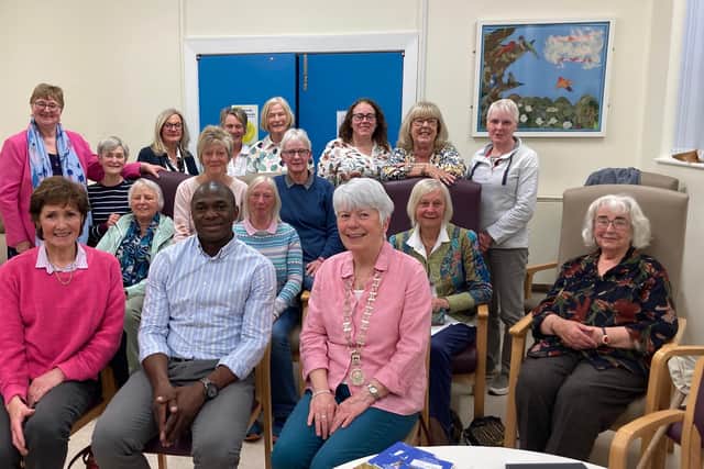 Members of Ballymoney Soroptimists with Solomon Lubwama, (front row) with President Ruth Elliott (third from left, front row)