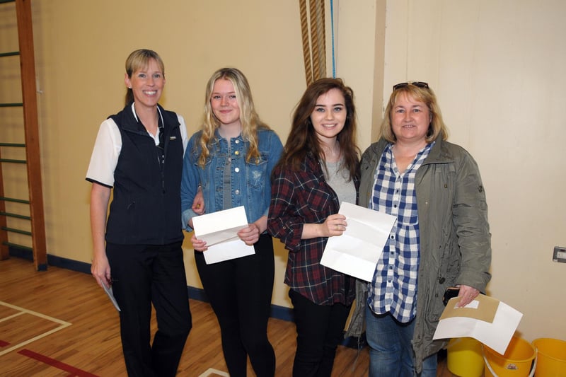 Downshire students Caitlin White and Jenna Whitten with their mums on results day 2015.  Caitlin achieved ABB and Jenna ABC. INCT 33-206-AM