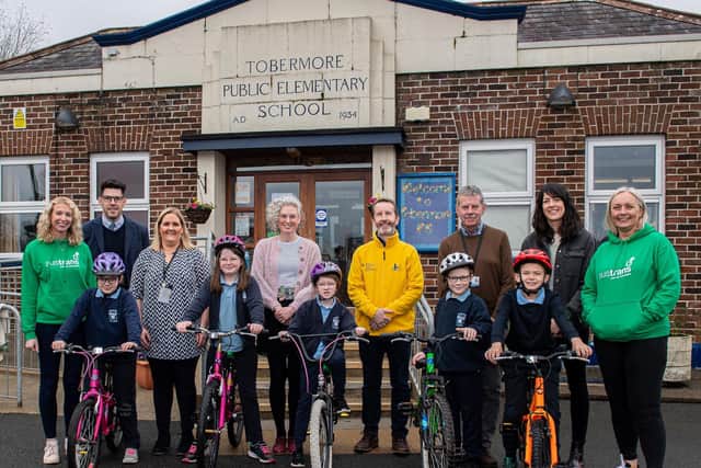 Pupils from Tobermore PS who take part in the Sustrans Active School Travel programme are joined by, from left, Laura Coey, Sustrans; Mr Cheevers, Tobermore PS Principal; Mrs Hawthorne, Tobermore PS Sustrans School Champion; Dr Hannah McCourt, Public Health Agency; Raymond McCullagh, Department for Infrastructure; Robert Irvine, non-executive director on the board of PHA; Beth Harding, Sustrans Active School Travel Programme Manager; and Geraldine McFadden, Sustrans for the launch of the Sustrans Big Walk and Wheel 2023.