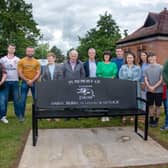 Close family members of Daryl Burke and David Warnock pictured at the new memorial bench on Saturday. PT24-304.