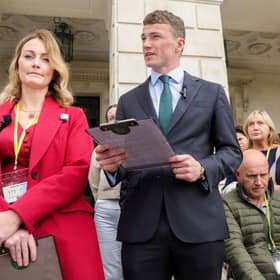 Tracey Bell from the Ladies with Letters campaign group, and Enda McGarrity, Director at PA Duffy & Co Solicitors on the steps of Stormont.
