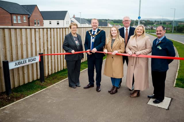 Ald Stephen Ross pictured cutting the ribbon at Jubilee Road, Ballyclare with Cllr Vera McWilliam, Cllr Jeannie Archibald-Brown, Cllr Michael Stewart, Ald Mandy Girvan and Cllr Norrie Ramsay.