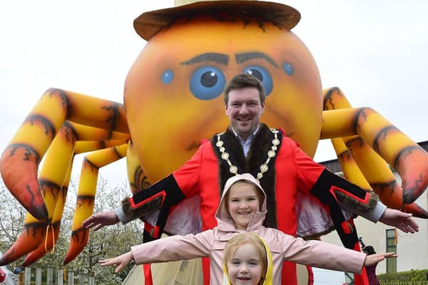 Mayor Carson and his daughters Isabella and Penelope enjoying the set-up for the Mayor's Carnival Parade and Family Fun Day.
